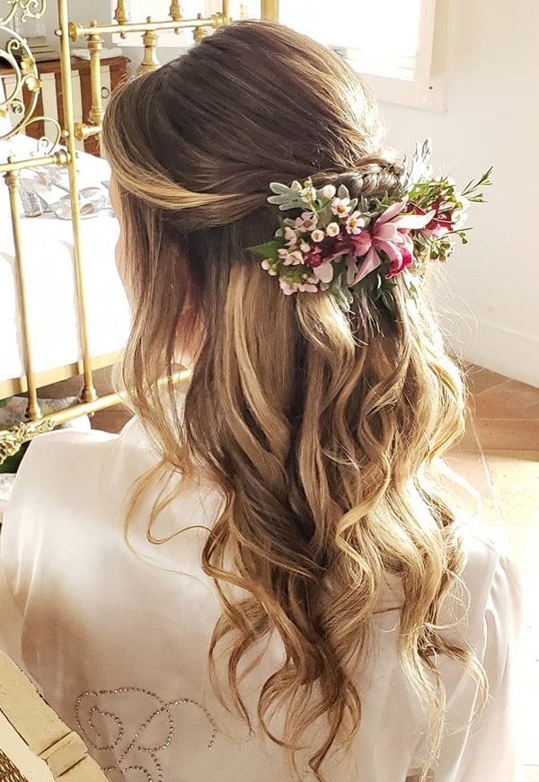 semi hairstyle stuck with natural flowers for bride