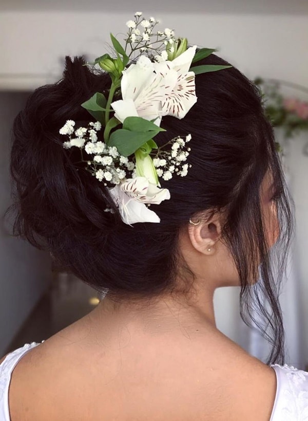 hairstyle for dark hair bride with natural flowers