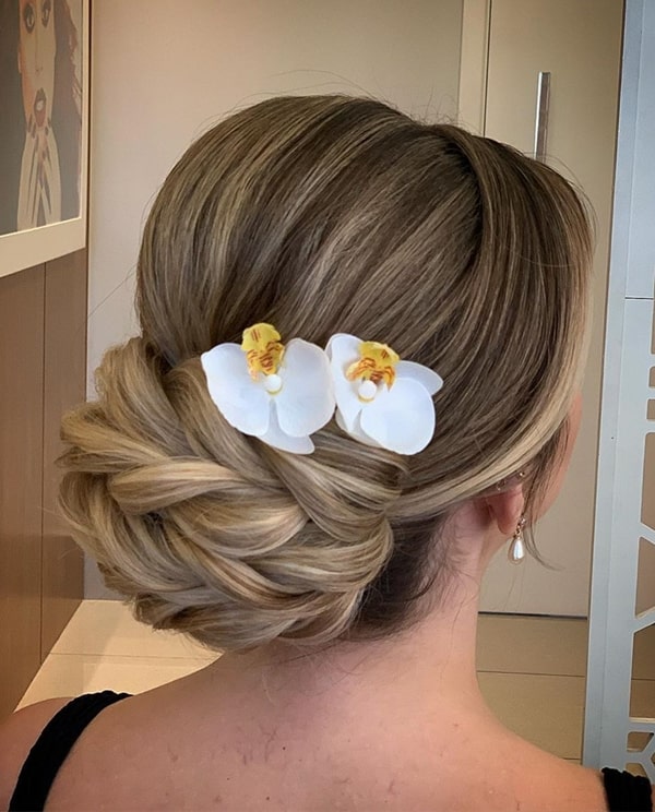 bun party hairstyle with flowers