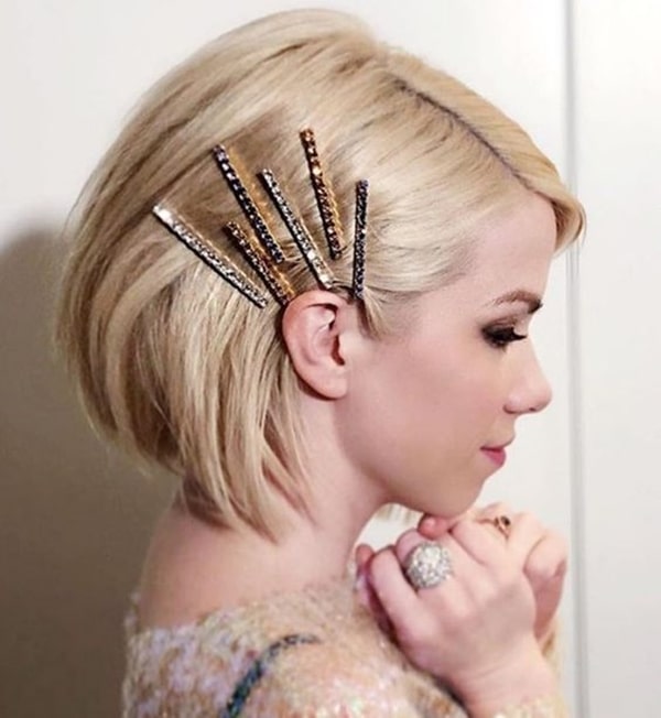chanel hair party hairstyle with clips and barrettes