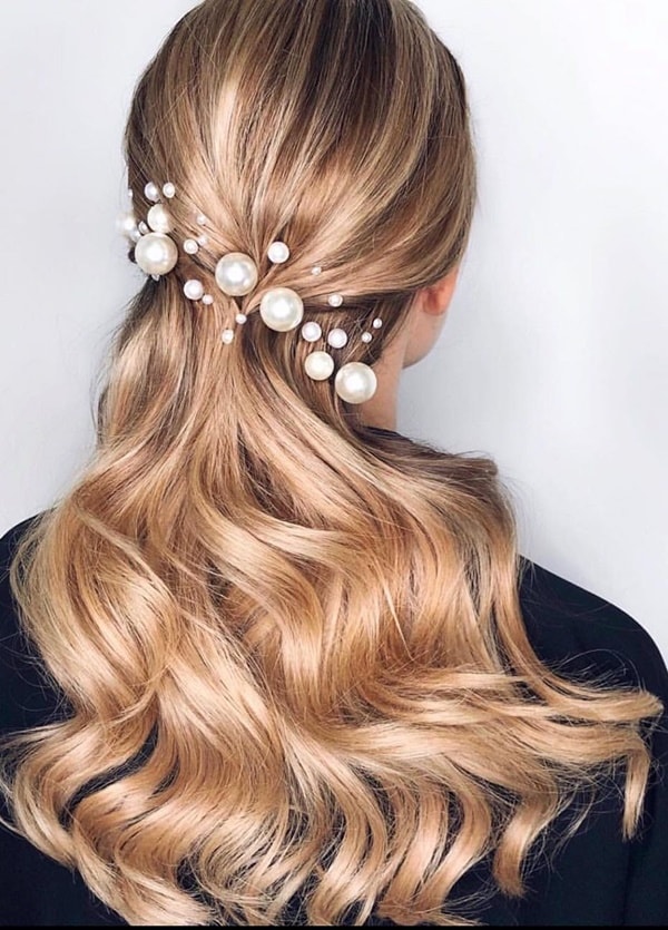 semi hairstyle pinned with pearls