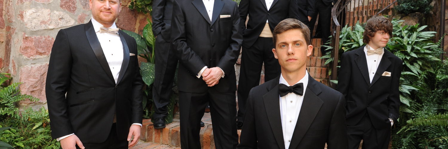 Do groomsmen rent or buy suits?