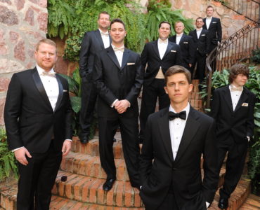 Do groomsmen rent or buy suits?
