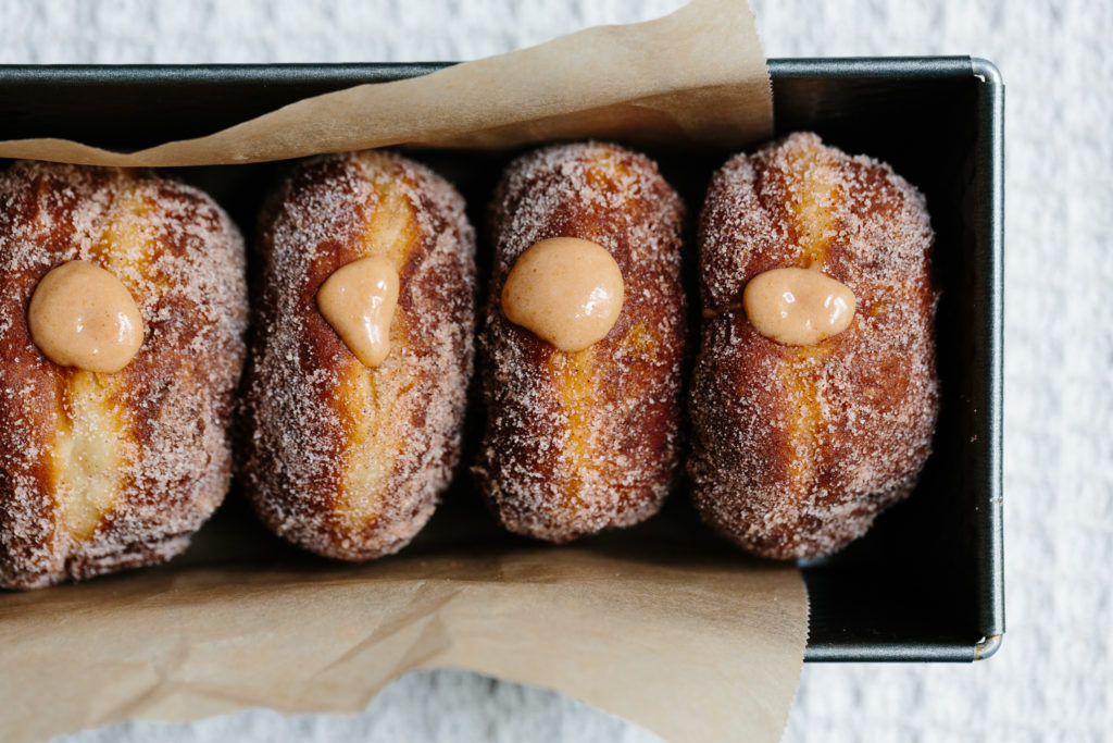 How did malasadas end up in Hawaii?