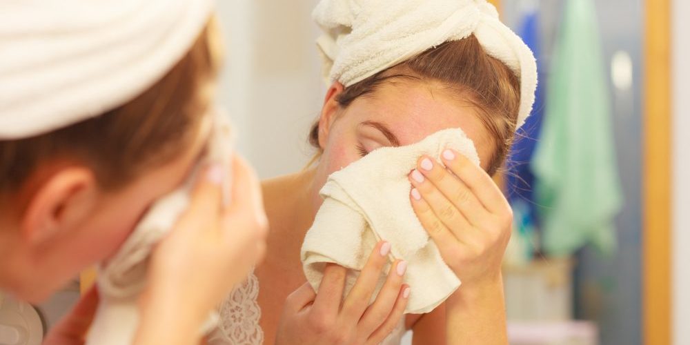 Should you wash your face with a washcloth or hands?