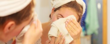 Should you wash your face with a washcloth or hands?