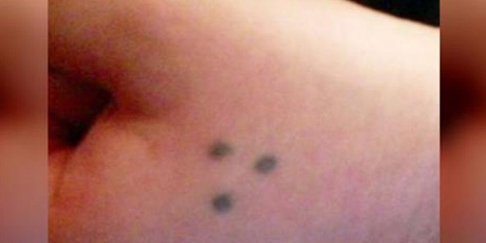 What does 3 dots tattoo mean?