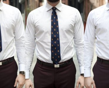 Where should a mans tie end?