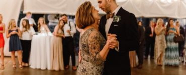 Who does the mother of the bride dance with?