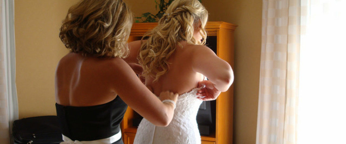 Who helps the bride get dressed?