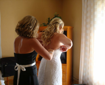 Who helps the bride get dressed?