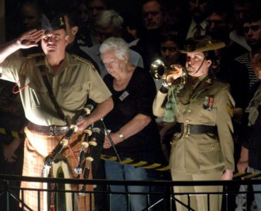 Who salutes during the Last Post?