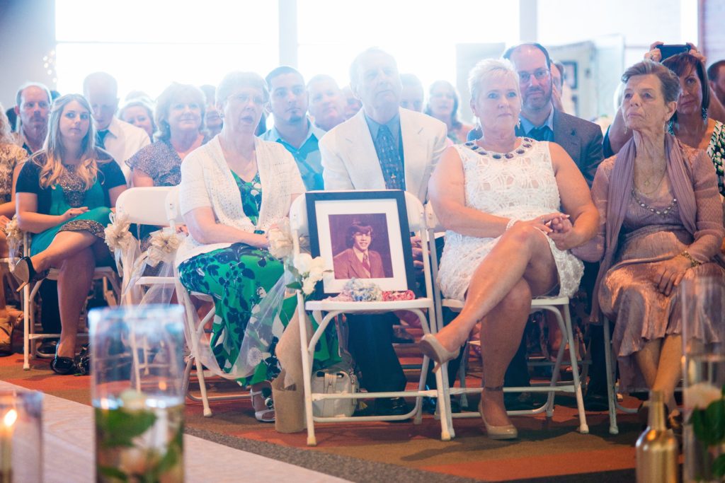 Who sits in the front row of a wedding?