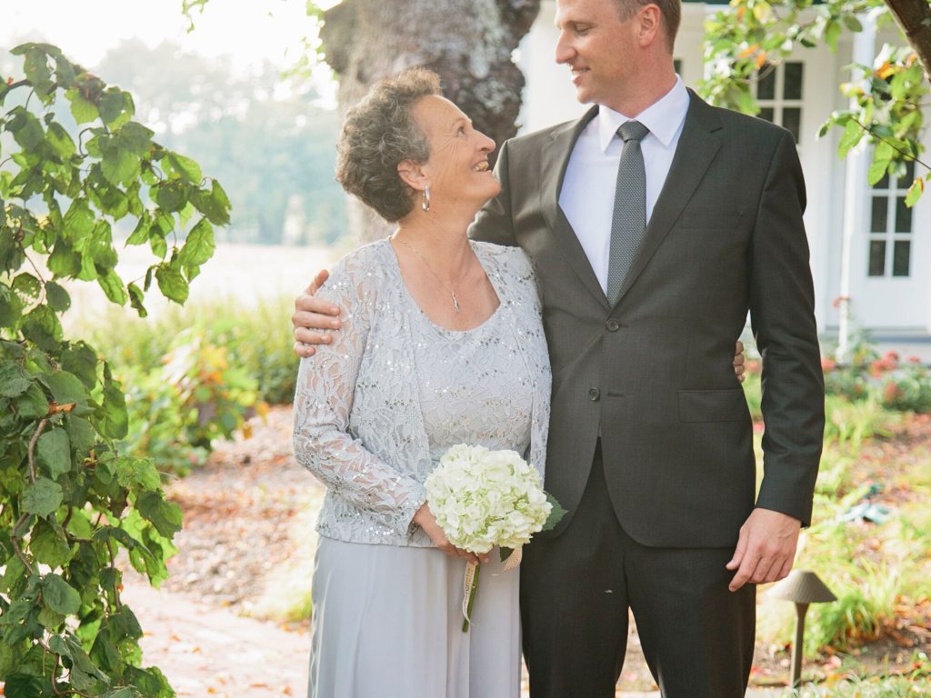 Who walks the groom's mother?