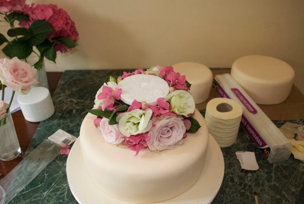 Why do wedding cakes have 3 tiers?