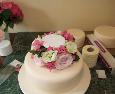 Why do wedding cakes have 3 tiers?